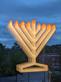 Illumin8 Window Menorah - Attached to window with powerful suction cups for secure display